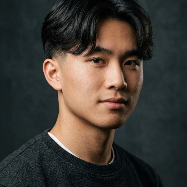 Low Taper Fade With a Middle Part 